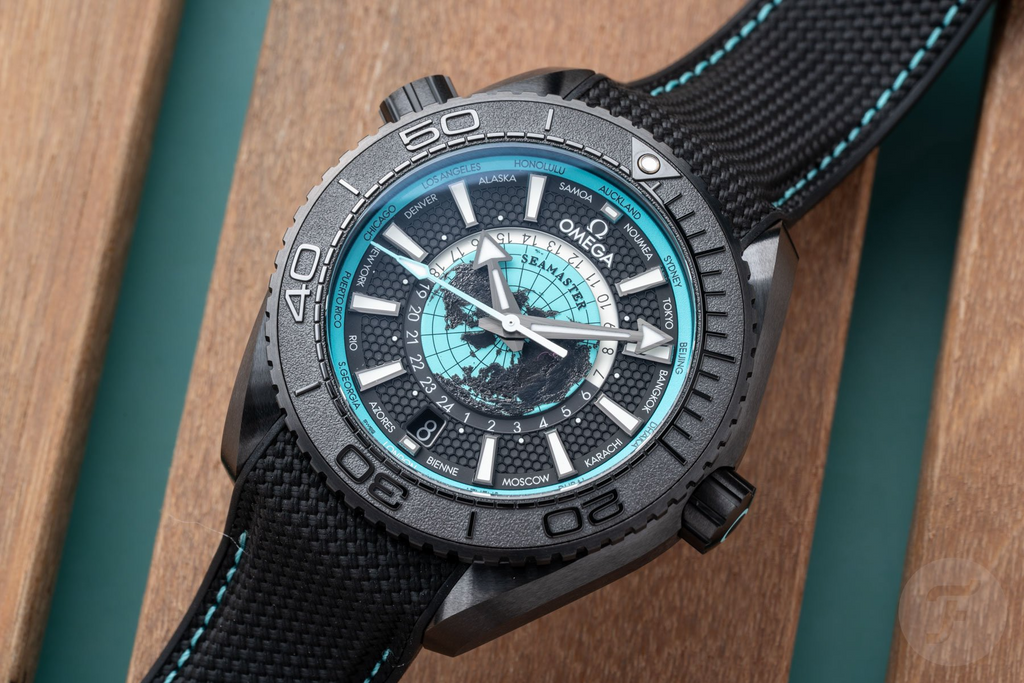 Luxury Swiss Watch | Planet Ocean Worldtimer | Automatic GMT | Black & Turquoise Dial | 904L Stainless Steel Case | Fabric Strap